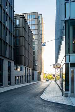 Modern architecture guiding an empty corporate street in the urban cityscape of the financial district, expressing business precision and future aligned composition