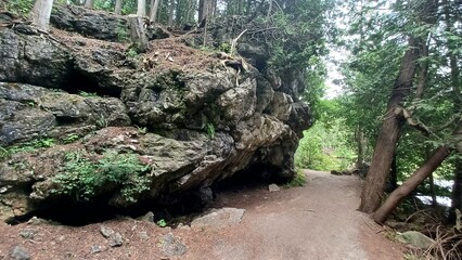​Large rock cave near path