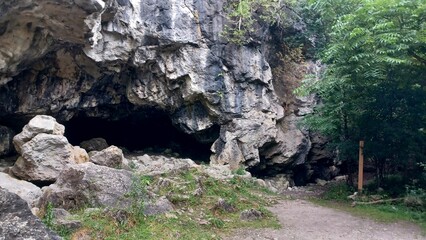 ​Large rock cave near path