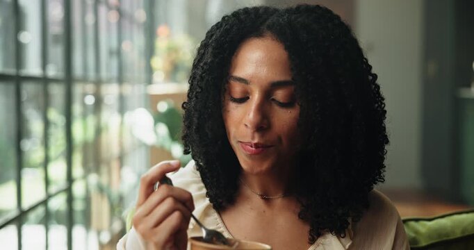 Woman, spoon and eating ice cream in living room for sweet treat craving, pudding and snack in home. Female person, gelato or frozen yogurt in house for dessert, comfort food and hunger satisfaction.