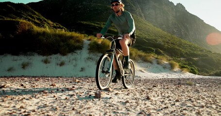 Sports, mountain and man on bicycle in morning for exercise, cardio workout and challenge outdoor. Countryside, travel and person cycling on bike for adventure, journey and health on nature trail