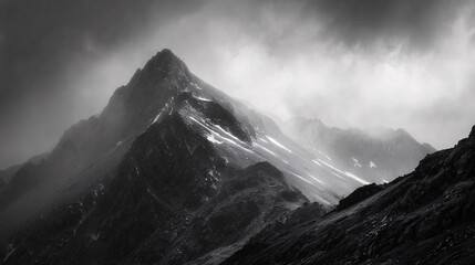 Dramatic Black and White Mountain Peak with Moody Cloudy Sky