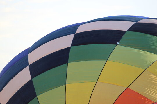 A macro image of a colorful hot air balloon in morning light
