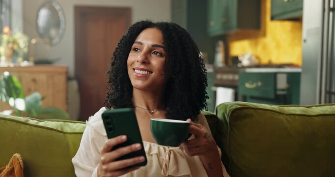 Coffee, phone and woman on sofa in home with networking, communication or social media on mobile app. Happy, cellphone and female person drinking warm beverage with texting, chatting or contact.