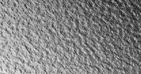 Grunge scratched metal texture background, rough metallic surface pattern, brushed steel abstract design in gray tones, industrial foil backdrop for modern design