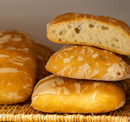 Tuscan bread panaccio fresh from oven stacking in basket