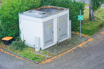 Large roadside transformer cabin with high voltage notice