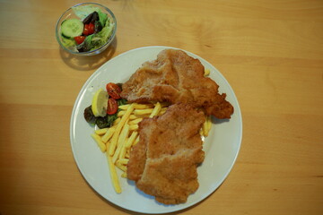 Crispy chicken schnitzel with fries