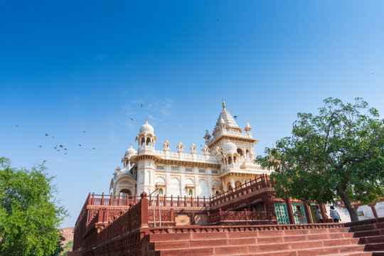 Beautiful view of Jaswant Thada cenotaph, Jodhpur, Rajasthan, India. Built out of intricately carved sheets of Makrana marble, they emit a warm glow when illuminated by the Sun. Blue sky background.