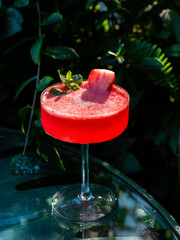 Strawberry daiquiri cocktail garnished with mint and strawberry