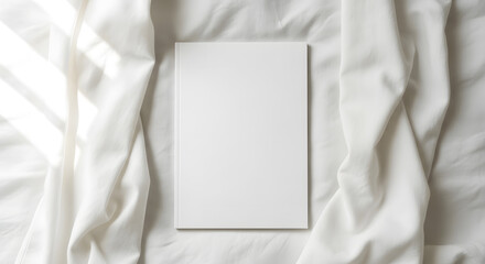 Fototapeta premium Blank white book cover mockup on white bed isolated