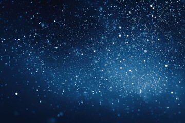 Majestic winter night sky filled with glowing particles, deep azure background, ideal for captivating holiday-themed graphics and banners
