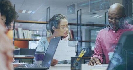 Office woman reviewing paper while senior man tapping notes causing data overlays sliding over desk - Powered by Adobe