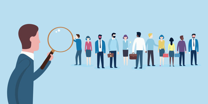 Magnifying glass examines diverse group of business people