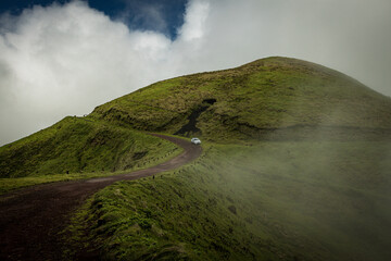 Foggy hills with green grass and the mist at Sao Jorge Island, Azores, Portugal