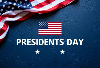 Presidents day concept with american flag and text on blue background, celebrating national holiday and patriotism