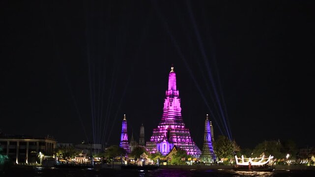 Chao Phraya River Sunset Video Background, see the colorful lights from the spotlights at the 2025 Chao Phraya River Festival, see the beautiful Wat Arun, a world-class tourist attraction.