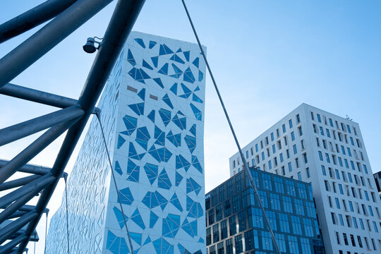 Architecture cityscape of Barcode Oslo concentrating on facade pattern building glass and daytime conditions that emphasize a precise modern urban detail.