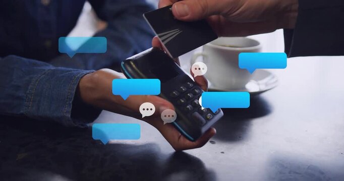 Cashier holding terminal and rotating it while customer tapping card, sparking payment chat bubbles
