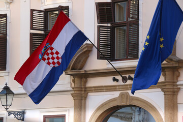 Croatian flag and flag of European Union on a historic Parliament building in uptown Zagreb,...
