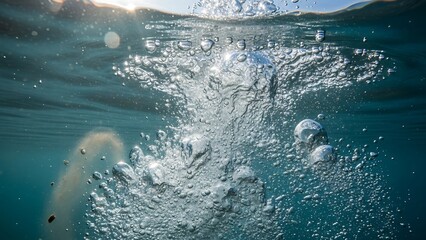 Underwater Bubbles Rising to the Surface in Clear Blue Water.