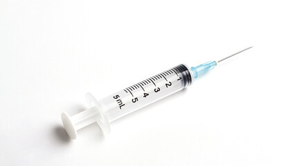 Sterile syringe placed on a clean white medical surface. Minimal clinical composition ideal for healthcare, vaccination, pharmaceutical branding, and medical presentations.