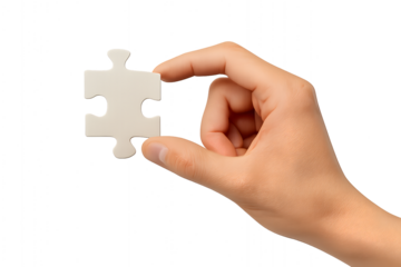 A hand holding puzzle piece for the concept of problem solving and decision making.