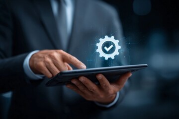 Business professional using tablet with digital gear symbol and check mark in modern corporate setting