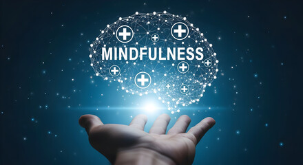 Hand reaches towards a digital brain with the word mindfulness representing mental health and wellness with a network of connections and plus signs against a dark blue starry background