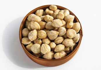 A pile of Candlenuts (Kemiri), a key ingredient in Southeast Asian cooking.