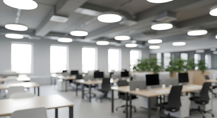Blurred office interior with desks and computers creating a modern workspace environment suitable for backgrounds and presentations