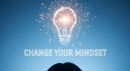 Change your mindset concept featuring a glowing lightbulb with a geometric design and sparkling lights on a blue background symbolizing innovation inspiration and positive thinking for personal growth