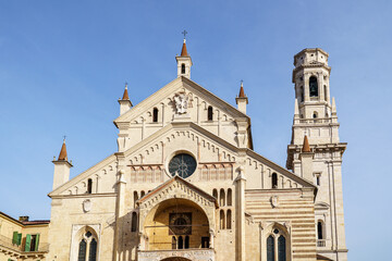 The cathedral complex in Verona, Italy. The building is made of white stone. The tower is visible...