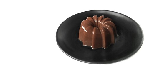 Chocolate Pudding Dessert Dish on a Black Plate. Food Photography Presentation. Isolated on White Background