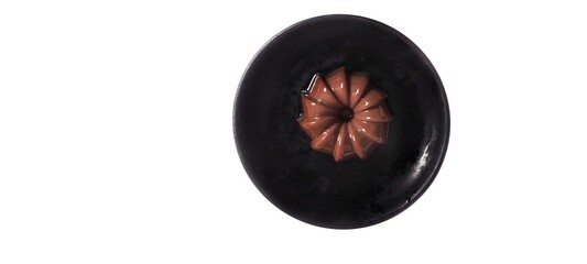 Chocolate Pudding Dessert Dish on a Black Plate. Food Photography Presentation. Isolated on White Background