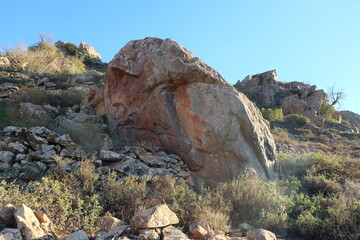 Beautiful mountain landscapes; rocky mountains; valleys; desert flora; blue skies;