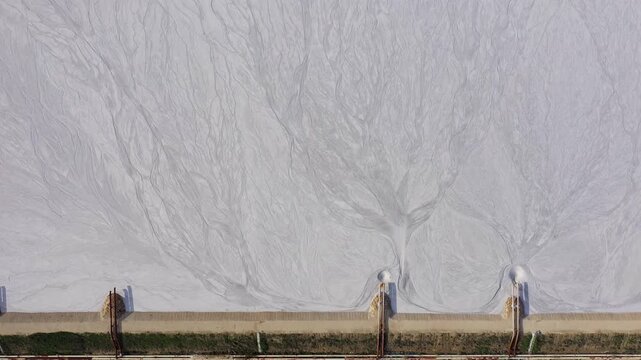 Aerial drone view of tailings pond near a cement factory near to Devnya, Varna, Bulgaria. Industrial scene of environmental impact