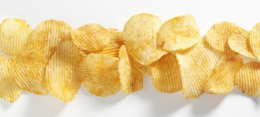 Potato chips on white