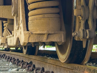 Closeup of a train wheel on a track, suitable for transportation, industrial, motion, engineering, and travelthemed designs or concepts. Authentic and dynamic visual impact.