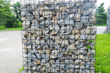 Stone wall of commercial site,various size geometric stones,natural slate stone background texture,rock texture of various shapes and sizes.
