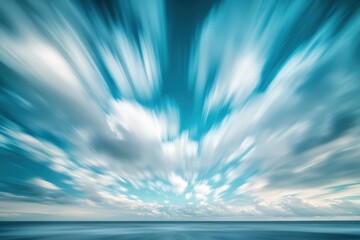 Obraz premium Striking, longexposure sky featuring blurred clouds radiating from a vibrant blue expanse. Evokes concepts like speed, motion, freedom, and inspiration. Perfect backdrop
