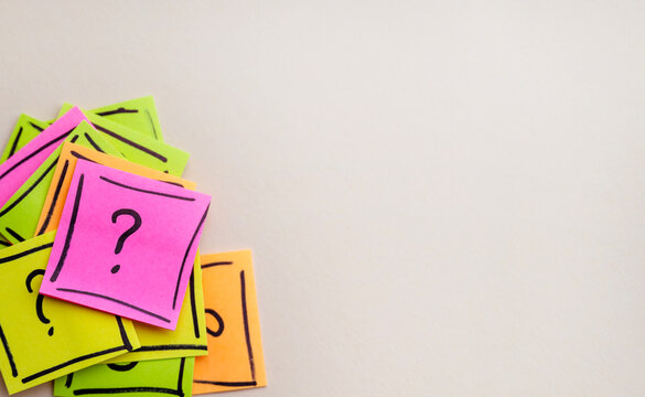 Question mark on  sticky notes - Powered by Adobe