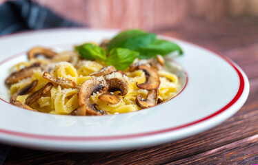 Tagliatelle pasta with  parmesan and mushrooms 