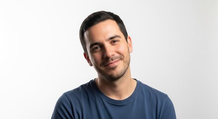 Fototapeta premium Smiling young man with dark hair looks confidently at camera isolated on white background