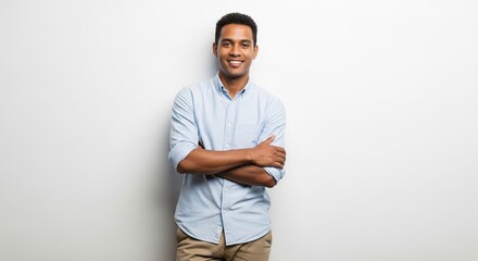 Confident smiling African American man with arms crossed looking at camera isolated on white background