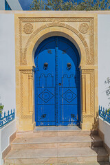 Typical ornamental traditional Tunisian door at the city of Cartagina in North African country of Tunisia.