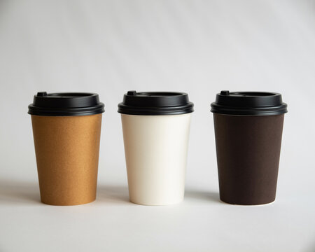 Three Disposable Coffee Cups with Black Lids takeaway