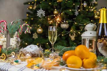 Champagne on the Christmas table. Selective focus.