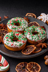 Christmas donuts or doughnuts, holiday winter sweets with sprinkles. Christmas donuts