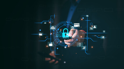 Businessman holding smartphone with cybersecurity lock hologram. Mobile banking and personal data protection concept. Digital network safety for secure online financial transactions.